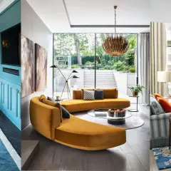 Diverse family room ideas: a teal media wall, a curved mustard sofa with garden views, and a striped sofa with a floral rug.