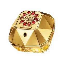 Złoty flakon perfum Paco Rabanne Lady Million Lucky, ozdobiony czerwonymi kamieniami i napisem "ROYAL", emanuje luksusem i szczęściem.