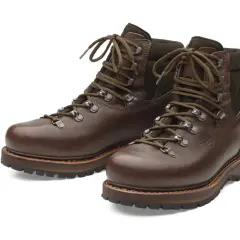 Brown leather hiking boots, crafted from durable yak leather, with sturdy soles and laces.