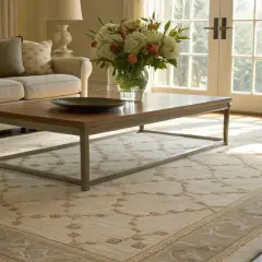 A low pile rug with a subtle geometric pattern anchors a bright living room, complementing a neutral sofa and coffee table.