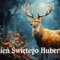 Majestatyczny jeleń w lesie, otoczony jesiennymi kwiatami. 14 listopada to Dzień Świętego Huberta, patrona myśliwych.