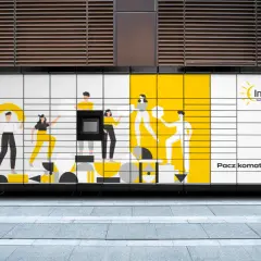 Paczkomat InPost z grafiką ludzi. Dowiedz się, jak przedłużyć paczkę w paczkomacie.
