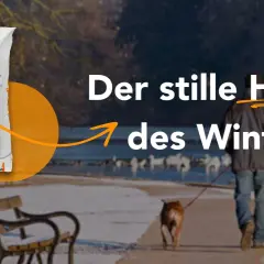 VIAFORM Granular: eine umweltfreundliche streusalz alternative für den Winterdienst. Ein Mann mit Hund spaziert am Wasser.