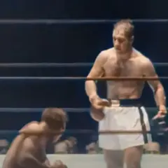 Rocky Marciano, known for his incredible power and fighting spirit, is shown in the ring. His weight was a key factor in his success.