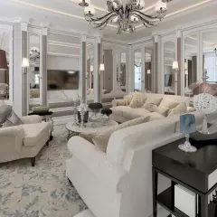 Eleganckie mieszkanie w stylu art deco z jasnymi sofami, lustrzanymi frontami szaf i ozdobnym żyrandolem.
