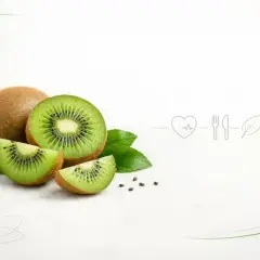 Całe i pokrojone kiwi z liśćmi, symbolizujące, czy kiwi jest zdrowe. Obok ikony serca, sztućców i liścia.