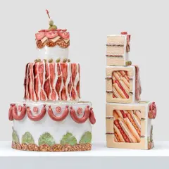 Whimsical Wayne Thiebaud cakes, one a tiered tower of savory meats and olives, the other stacked cubes revealing hot dogs and sandwiches.