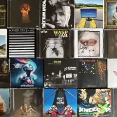 A collage of CD covers, featuring 80s artists like Kim Wilde and A Flock of Seagulls, alongside modern music.