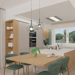 Cucina moderna con isola centrale, tavola in legno e sedie verdi. L'ambiente è dominato da **colori neutri** e finiture naturali, con un tocco di verde dalle piante.