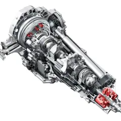 Przekładnia s tronic z widocznymi elementami hydraulicznymi i mechanicznymi.