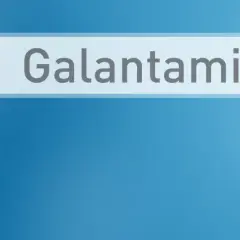 Lekarz w białym kitlu wskazuje palcem na pole wyszukiwania z napisem "Galantamine". Nivalin to nazwa handlowa leku zawierającego galantaminę.