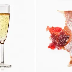 Glas Prosecco und ein angebissener Krapfen mit Marmelade. Über Prosecco Kalorien muss man sich hier wohl keine Gedanken machen.