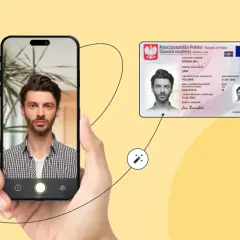 Mężczyzna robi sobie zdjęcie telefonem, obok widoczny dowód osobisty.