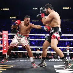 A cruiserweight boxer lands a punch on a heavyweight opponent in a thrilling round 1 match.
