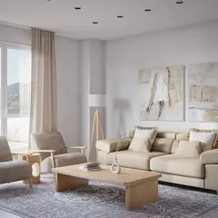 Sofá beige, dos sillones, mesa de centro de madera y una lámpara de pie trípode iluminan este salón moderno.