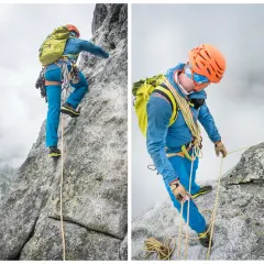 Dwóch alpinistów wspina się na mnicha w Tatrach. Jeden z nich, w niebieskiej kurtce, pokonuje skalną ścianę, drugi, w zielonej kurtce, asekuruje go.