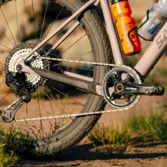 Close-up of a gravel bike's drivetrain, featuring Shimano GRX components. A detailed shimano grx review would highlight this robust gearing.