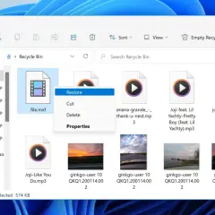 Recycle Bin shows a deleted file.mxf, a video file, with a context menu open offering to restore it.