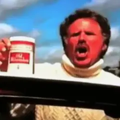 Will Ferrell med solbränd hy och vit polotröja håller upp en burk Old Spice.