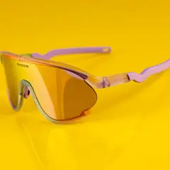 Okulary rowerowe Olivio & Co z pomarańczowymi soczewkami i fioletowymi zausznikami. Idealne na rower!