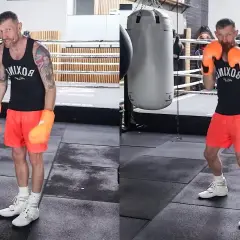 Boxer demonstrates the correct stance for a right hook, showing proper footwork and guard.