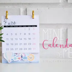 Mini calendarios imprimibles de enero con adornos de globos y arcoíris.