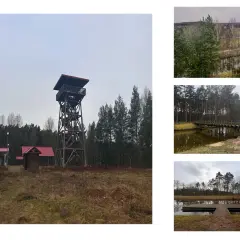 Wieża widokowa i małe budynki z czerwonymi dachami w pobliżu akweduktu w Fojutowie. W oddali las i krajobraz.