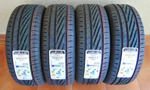 Cztery nowe opony Uniroyal RainSport 5 o rozmiarach 205/55 R 16 91V, z etykietami energetycznymi.