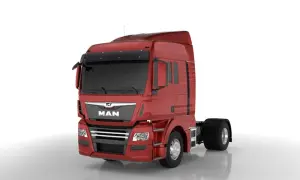 Cabine rouge d'un camion MAN, prête pour une longue route. Ce camion américain est un géant des autoroutes.
