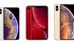 Trzy telefony iPhone: biały, czerwony i złoty. Złoty iPhone XS Max ma wymiary idealne do dłoni.