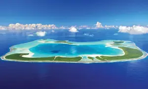 En grönskande atoll med turkost vatten, en dröm om Franska Polynesien.