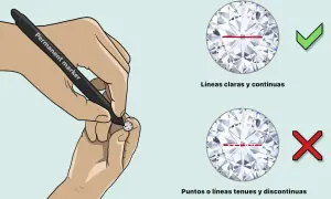 Manos marcan un diamante real con un rotulador. Línea clara y continua es correcta, puntos o línea discontinua es incorrecta.
