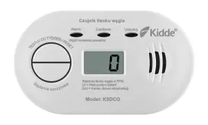 Biały czujnik tlenku węgla Kidde z wyświetlaczem pokazującym "0" i przyciskiem Test/Reset.