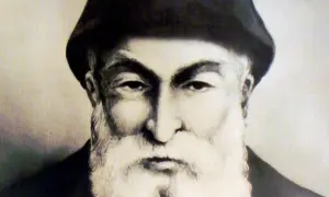 Portret ojca Szarbel, starszego mężczyzny z bujną białą brodą i w czarnym nakryciu głowy.