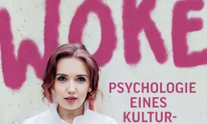 Junge Frau vor Schriftzug "WOKE". Der Text darunter lautet "Psychologie eines Kulturkampfes".
