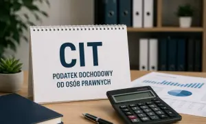 Biurko z kalendarzem "CIT PODATEK DOCHODOWY OD OSÓB PRAWNYCH", kalkulatorem, notatnikiem i wykresami.