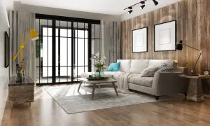 Soggiorno moderno con divano beige, tavolino in legno, tappeto grigio e parete effetto legno. Un esempio di come arredare casa con poco, puntando su pochi elementi ben scelti.