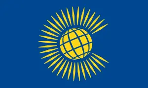 Bandera azul con un globo terráqueo amarillo rodeado de rayos amarillos, representando el Commonwealth.