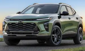 Nowy Chevrolet Trax w zielonym kolorze, z czarnymi felgami, prezentuje się dynamicznie na tle krajobrazu.