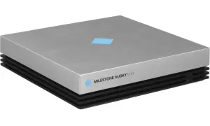 Srebrny rejestrator monitoringowy Milestone Husky M10 z niebieskim logo.