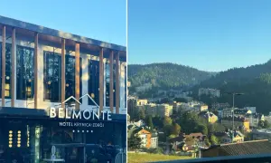 Nowoczesny hotel Belmonte w Krynicy-Zdroju z widokiem na górskie miasteczko.