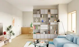Helle, moderne wohnzimmer inspiration mit einem blauen Sofa, einem Glas-Couchtisch und einem großen Regal voller Bücher und Deko.