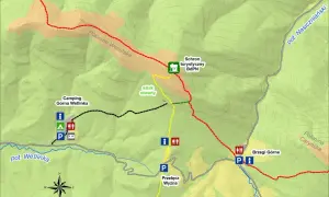 Mapa turystyczna z zaznaczonym szlakiem prowadzącym do Schroniska BdPN i na Połoninę Wetlińską. Widać camping i potok Wetlinka.