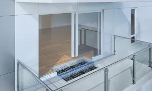 Przekrój nowoczesnego balkonu z widocznym połączeniem balkonu ze stropem, systemem ogrzewania i szklaną balustradą.