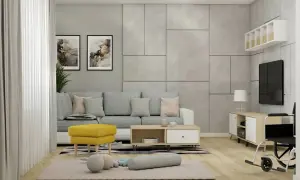 Nowoczesny salon z szarą sofą i żółtym pufem. W tle betonowa ściana i telewizor. Całość utrzymana w ciepłym szarym kolorze.