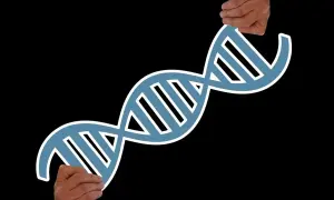 Dwie dłonie trzymają symbol DNA, sugerując pytanie: czy borderline jest dziedziczne?