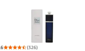 Elegancki flakon Dior Addict EDP w granatowym kolorze obok swojego białego opakowania.