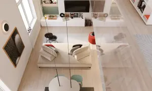 Un angolo di casa moderno e accogliente, perfetto per arredare con stile. Divano bianco, tavolino nero, quadri e giradischi creano un'atmosfera unica.