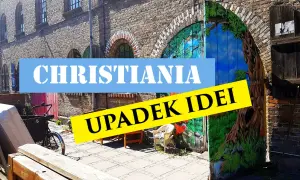 Freetown Christiania, z malowaną bramą i rowerem towarowym.