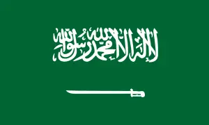 Flaga Arabii Saudyjskiej z napisem po arabsku i szablą. Planujesz podróż? Sprawdź wymagania dotyczące wizy do Arabii Saudyjskiej.